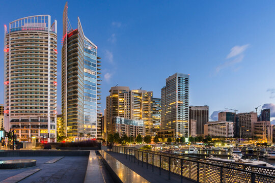 A Beirut skyline with icons representing banking, retail, and telecom sectors