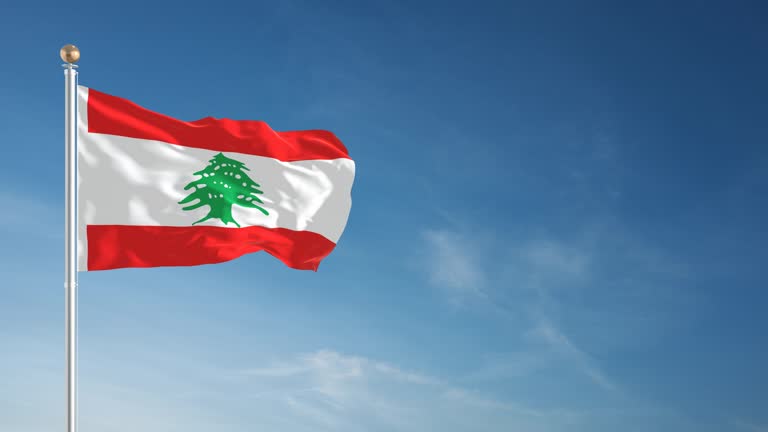 A Lebanese flag flying above empty government office buildings in central Beirut on a sunny day
