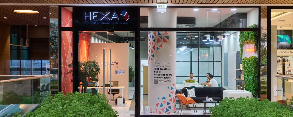 Members working at desks inside Hexa Coworking at Mall