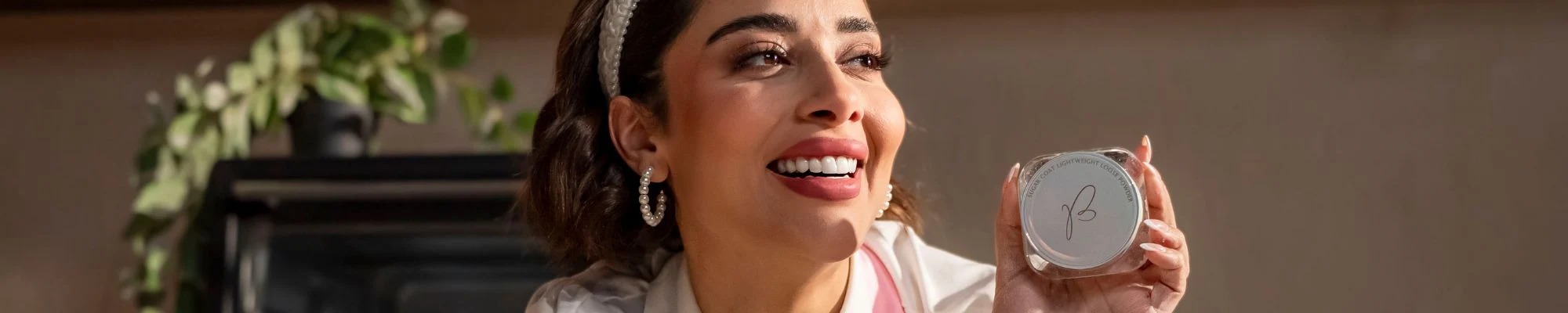 BEX Beauty makeup and skincare products arranged on a soft neutral surface, with the brand founded by Balqees Fathi, marking the brand's arrival in Lebanon