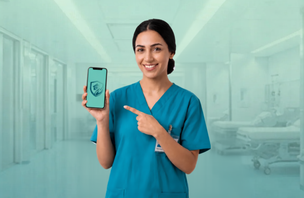 A smiling nurse in teal scrubs with a name badge holds up a smartphone showing the Sohhtak app logo and points at the screen, standing in a bright teal-toned hospital corridor.