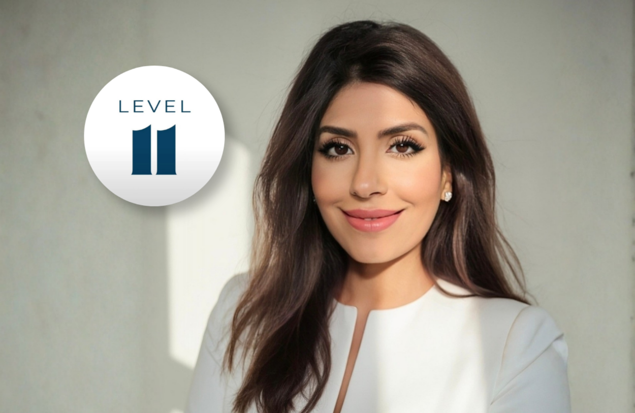 Ghina Itani, founder of LEVEL11 Advisory, in a white jacket beside the LEVEL11 logo