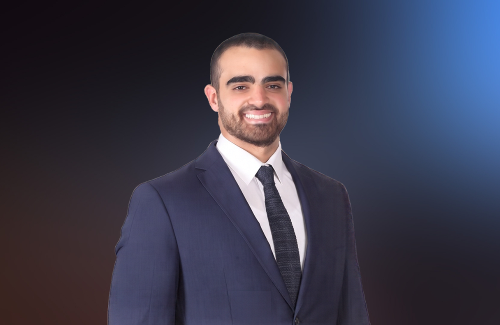Fadi Kanaan in a navy suit standing in front of the American University of Beirut campus