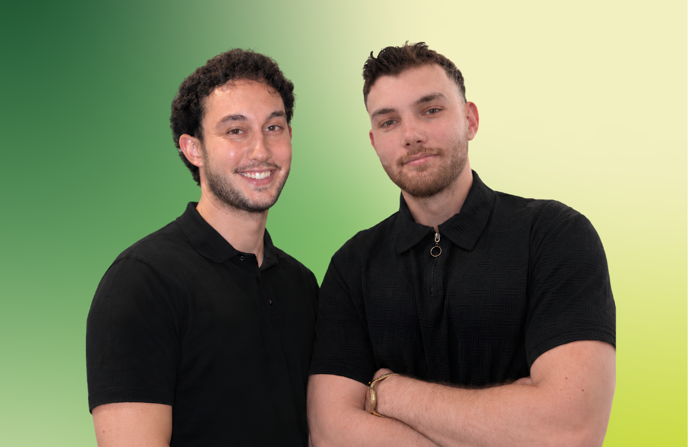 Metal Gainz co-founders Kareem Rafei and Akram Kais in black polo shirts, standing side by side against a green gradient background